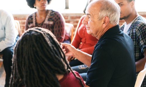 A group of people casually discussing issues