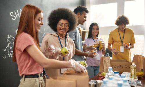 A group of volunteers packing donation food